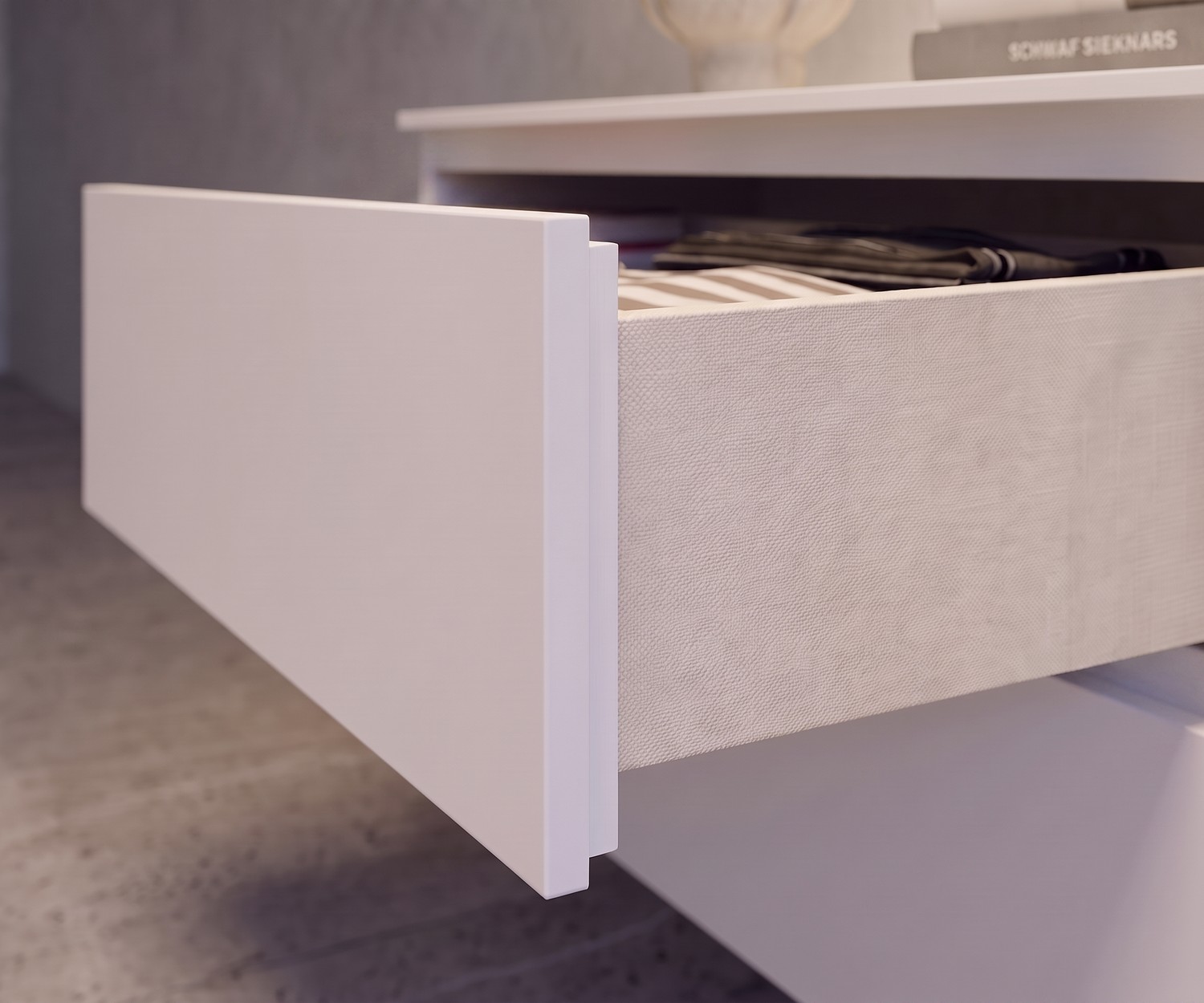 Commode suspendue Easy de Novamobili, détail du tiroir ouvert avec effet tissu à l'intérieur, design blanc minimaliste
