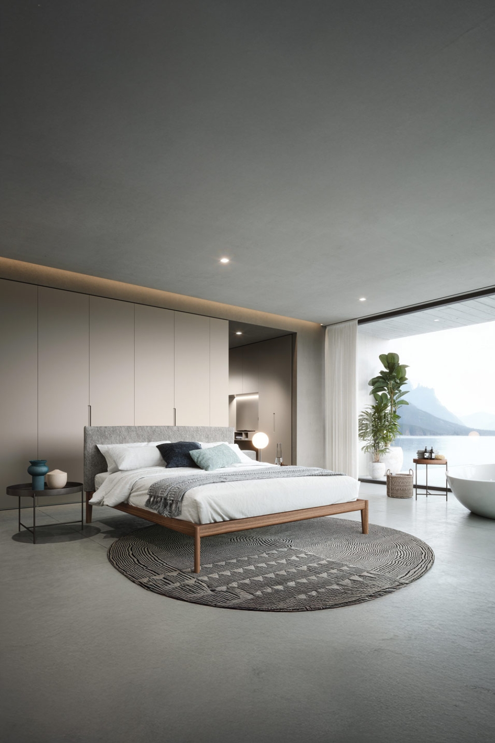 lit-et-armoire-au-design-linéaire-dans-une-chambre-spacieuse-avec-une-grande-fenêtre