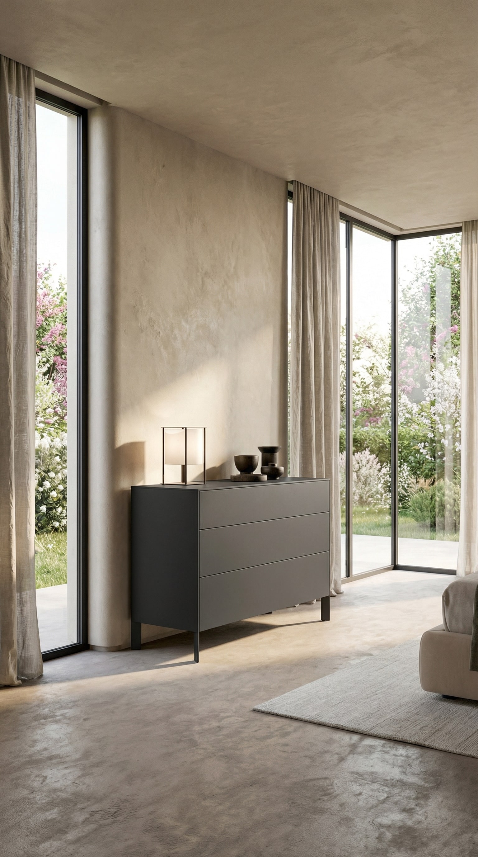 Commode minimaliste gris foncé devant un mur beige avec une douce lumière printanière Commode minimaliste gris foncé devant un mur beige avec une douce lumière printanière