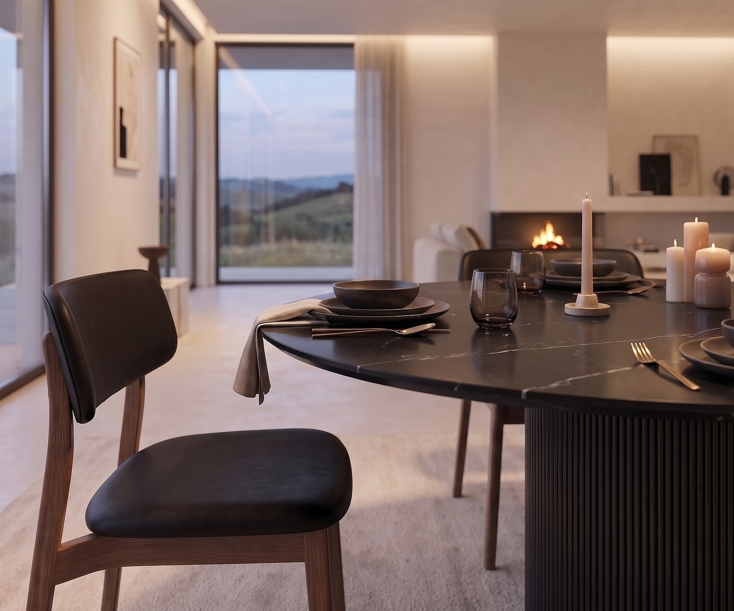 Table à manger ronde al2 dakry br 001 dans une salle à manger moderne, avec plateau en céramique noire et pied cannelé.